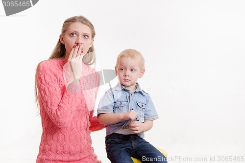 Image of Young mother is shocked by three sons