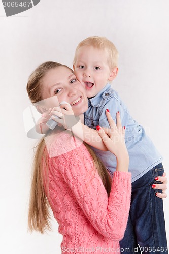 Image of Mom hugging her son with soap bubbles