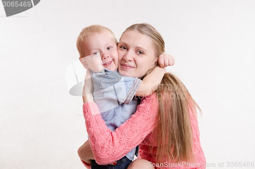 Image of The three-year child hugging her mother