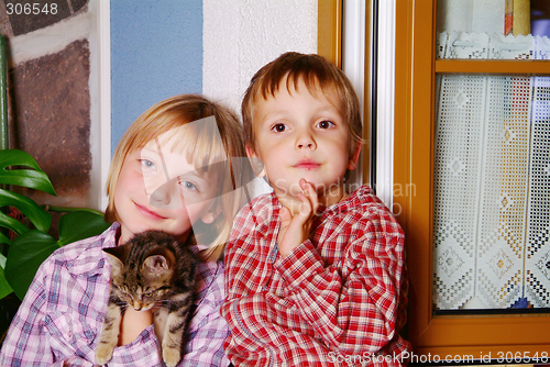 Image of children and cat