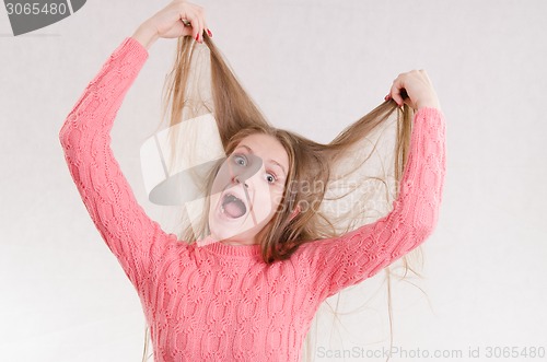 Image of Girl shocked by her hair