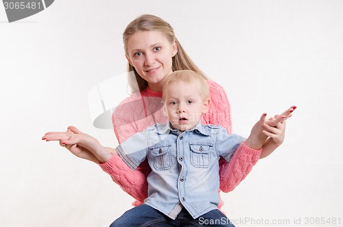 Image of Mom sat holding hands with his son