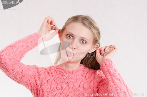 Image of Portrait of cheerful girl grimace