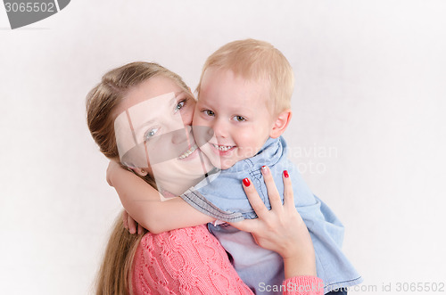 Image of Young girl hugging a boy