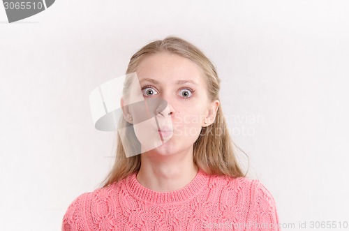 Image of Young girl with big eyes and wonder