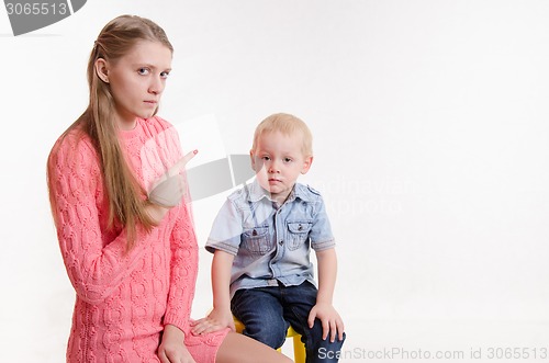 Image of Mom scolds boy