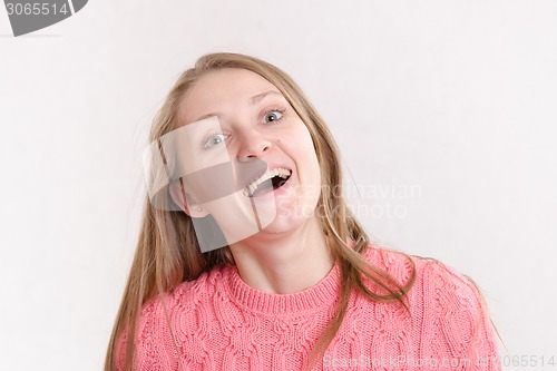 Image of Portrait of the laughing girl on a light background