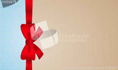 Image of brown and blue cardboard with red bow