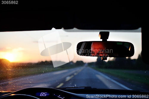 Image of reflected in the mirror of car driver