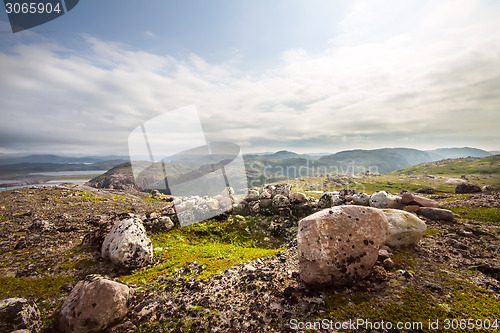 Image of polar tundra and stone heaps  human ancient