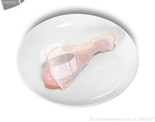 Image of Single Raw Chicken Legs On White Plate