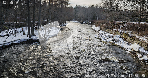 Image of Spring landscape with a small river in flood 