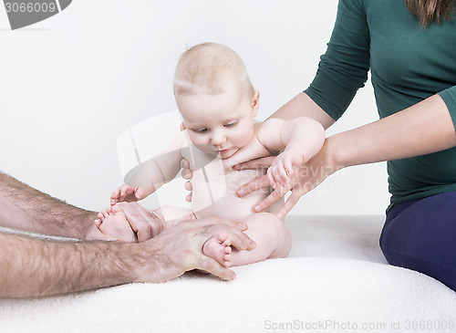 Image of parent holds her baby 