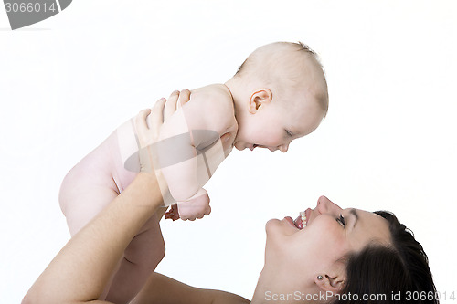 Image of Mother holds her baby high