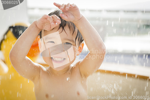 Image of Mixed Race Boy Having Fun at the Water Park