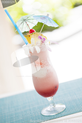 Image of Fruity Tropical Drink with Pineapple and Umbrullas