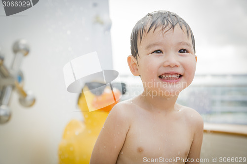 Image of Mixed Race Boy Having Fun at the Water Park