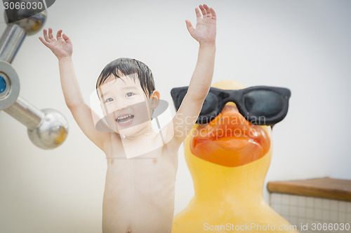 Image of Mixed Race Boy Having Fun at the Water Park