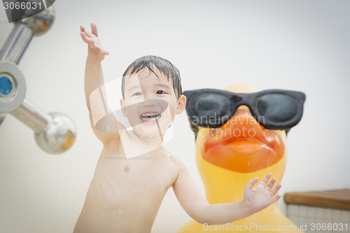 Image of Mixed Race Boy Having Fun at the Water Park