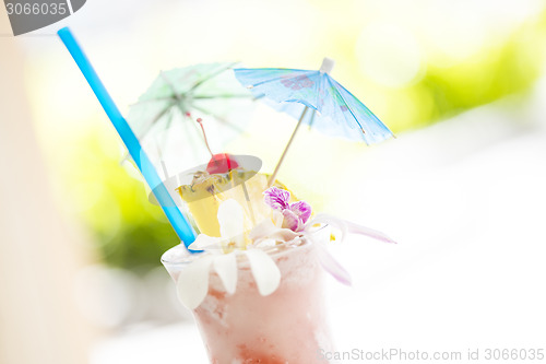 Image of Fruity Tropical Drink with Pineapple and Umbrullas