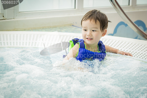 Image of Mixed Race Boy Having Fun at the Water Park