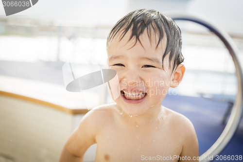 Image of Mixed Race Boy Having Fun at the Water Park