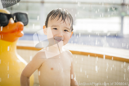 Image of Mixed Race Boy Having Fun at the Water Park