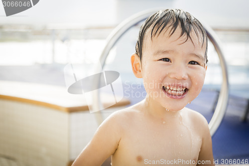 Image of Mixed Race Boy Having Fun at the Water Park