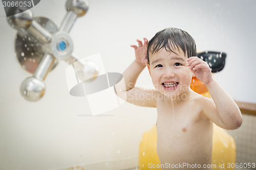 Image of Mixed Race Boy Having Fun at the Water Park