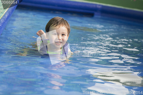 Image of Mixed Race Boy Having Fun at the Water Park