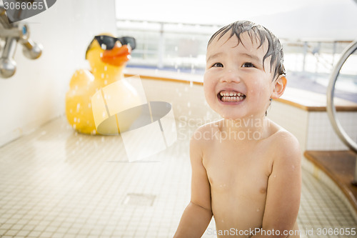 Image of Mixed Race Boy Having Fun at the Water Park