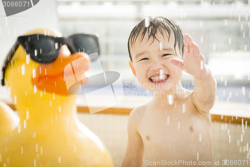 Image of Mixed Race Boy Having Fun at the Water Park