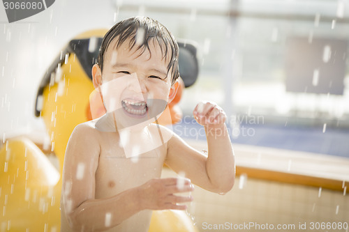 Image of Mixed Race Boy Having Fun at the Water Park