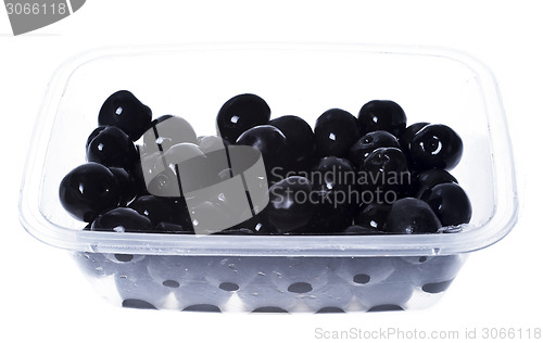 Image of olives in plastic box surface isolated