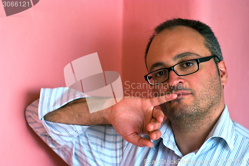 Image of Serious bearded caucasian man wearing eyeglasses 