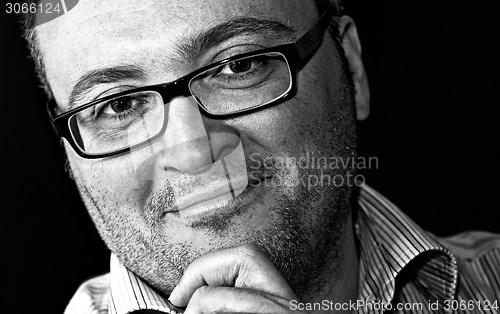 Image of Monochrome shot smiling bespectacled bearded caucasian man 