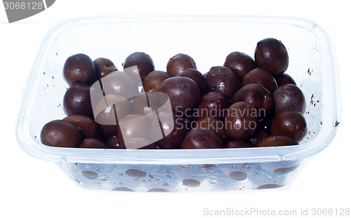 Image of olives in plastic box surface isolated