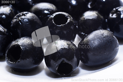 Image of Black pitted olives isolated 