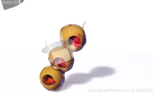 Image of Three olives on a toothpick.