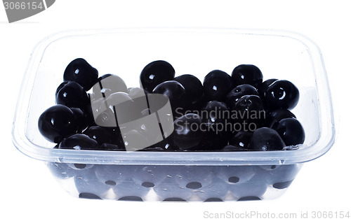 Image of olives in plastic box surface isolated