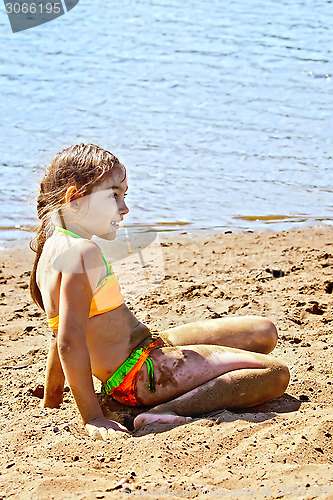 Image of Girl on sand by the river