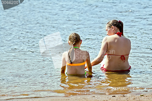 Image of Mother and daughter in the water