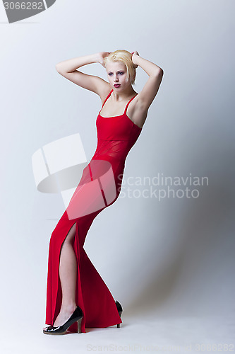 Image of beautiful sensual blond girl in red clothes