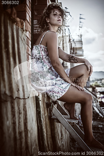 Image of girl sitting on the stairs 