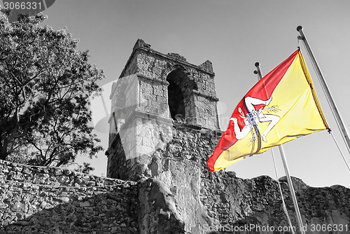 Image of Sicilian flag on old architecture