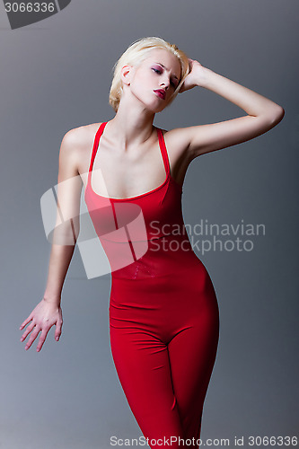 Image of emotive attractive girl in red dress