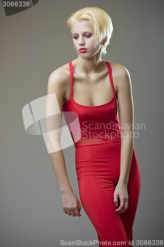 Image of beautiful sensual blond girl in red clothes