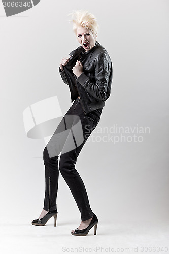 Image of affective scream blond girl in black leather