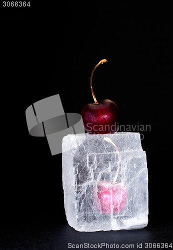 Image of Frozen sweet cherry on black