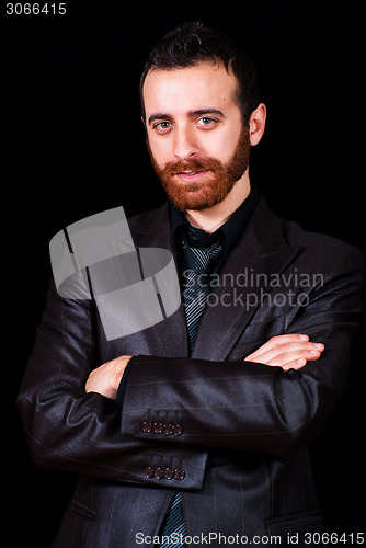 Image of young businessman portrait on a black background